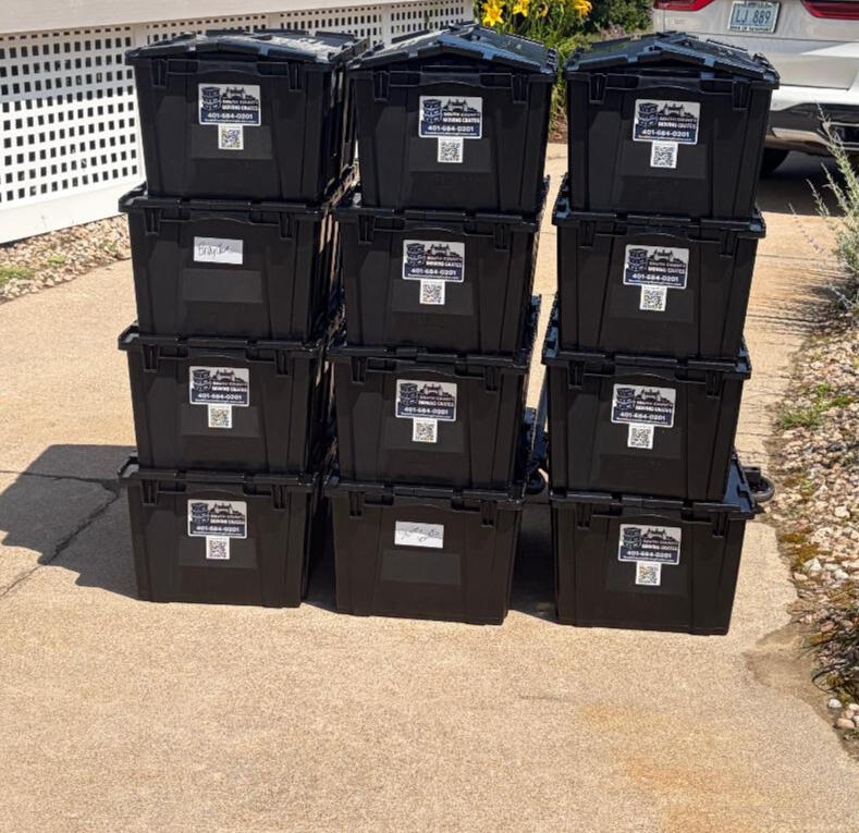 Untitled 12 loaded and stacked crates showing labels